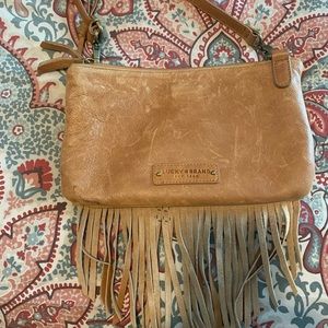 Camel color leather fringe purse. 10x6.5 with three compartments.